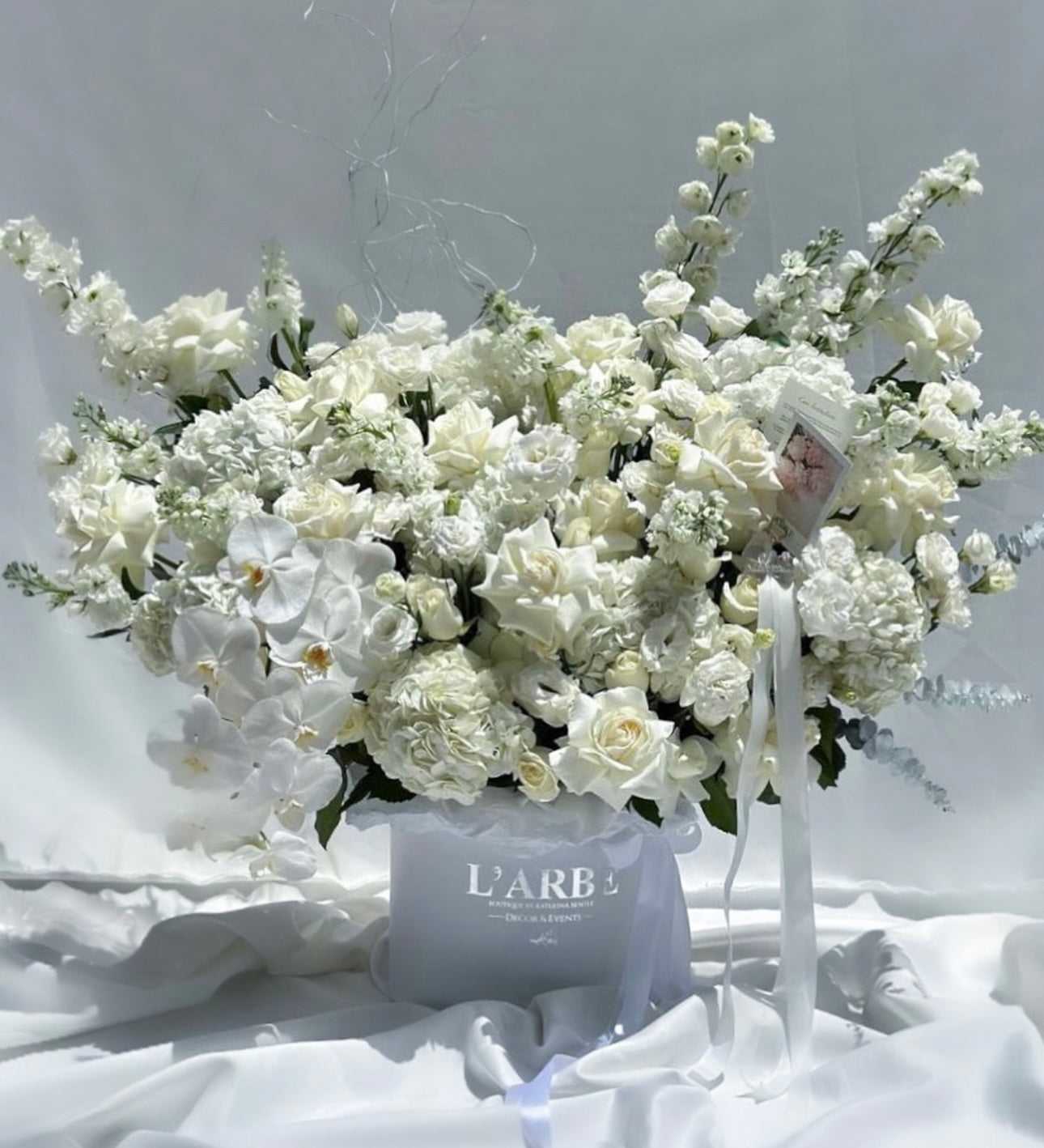 TOTAL WHITE FLOWERS BOUQUET IN BOX WITH ORCHIDS, HYDRANGEA AND ROSES