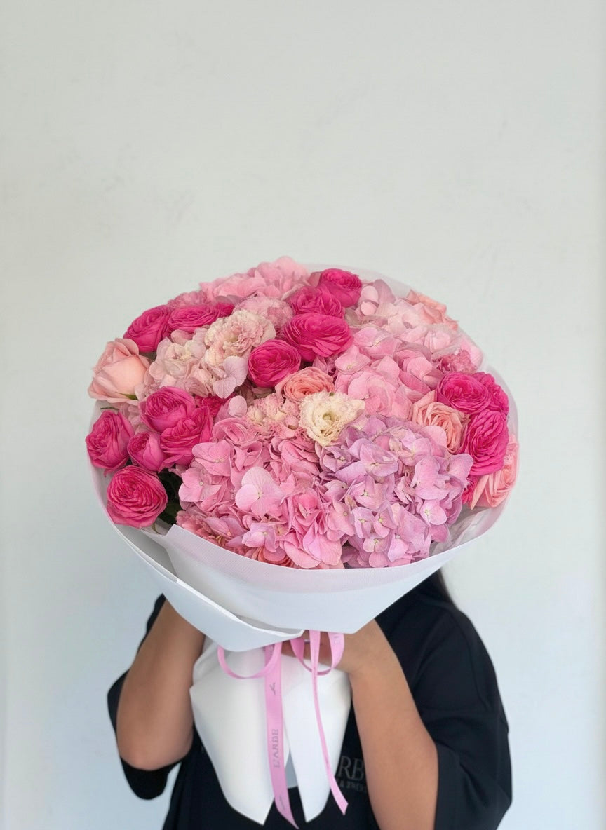 FLOWERS BOUQUET WITH PINK ROSES AND HYDRANGEAS IN WHITE WRAPPING