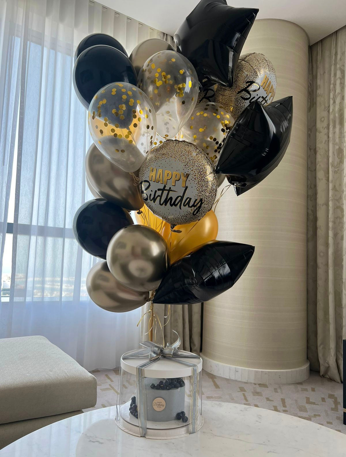 Black and gold HB balloons