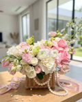WHITE AND PINK FLOWERS ARRANGEMENT IN BASKET WITH ROSES, RANUNCULUS AND MATTHIOLA “ELYSIAN” 011222