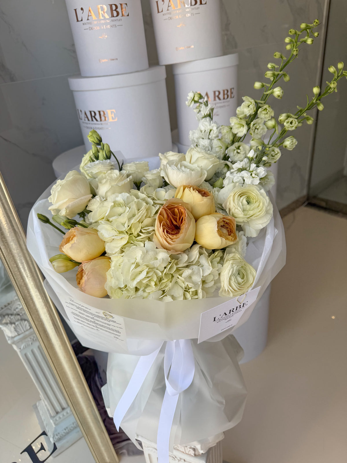 FLOWERS ARRANGEMENT WITH DELPHINIUM AND DAVID AUSTIN ROSES AND RANUNCULUS “SANTORI”