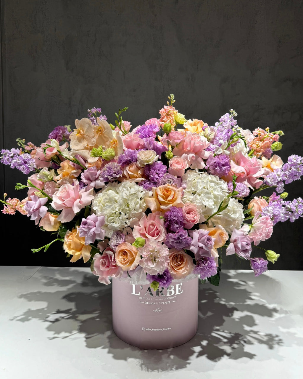 LILAC SHADES FLOWERS BOUQUET IN BOX WITH HYDRANGEA, MATTHIOLA AND FREESIA