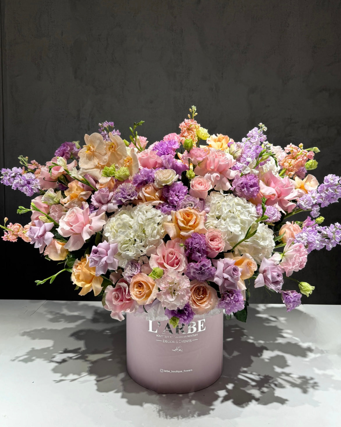 LILAC SHADES FLOWERS BOUQUET IN BOX WITH HYDRANGEA, MATTHIOLA AND FREESIA
