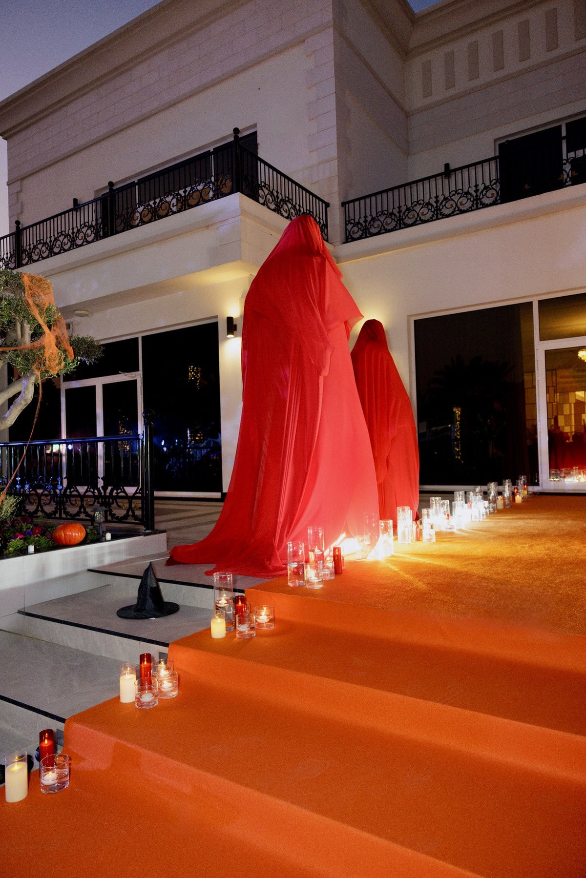 Crimson Ghosts Luxury Halloween Welcome Area with Red Draped Figures & Candlelit Walkway - rent