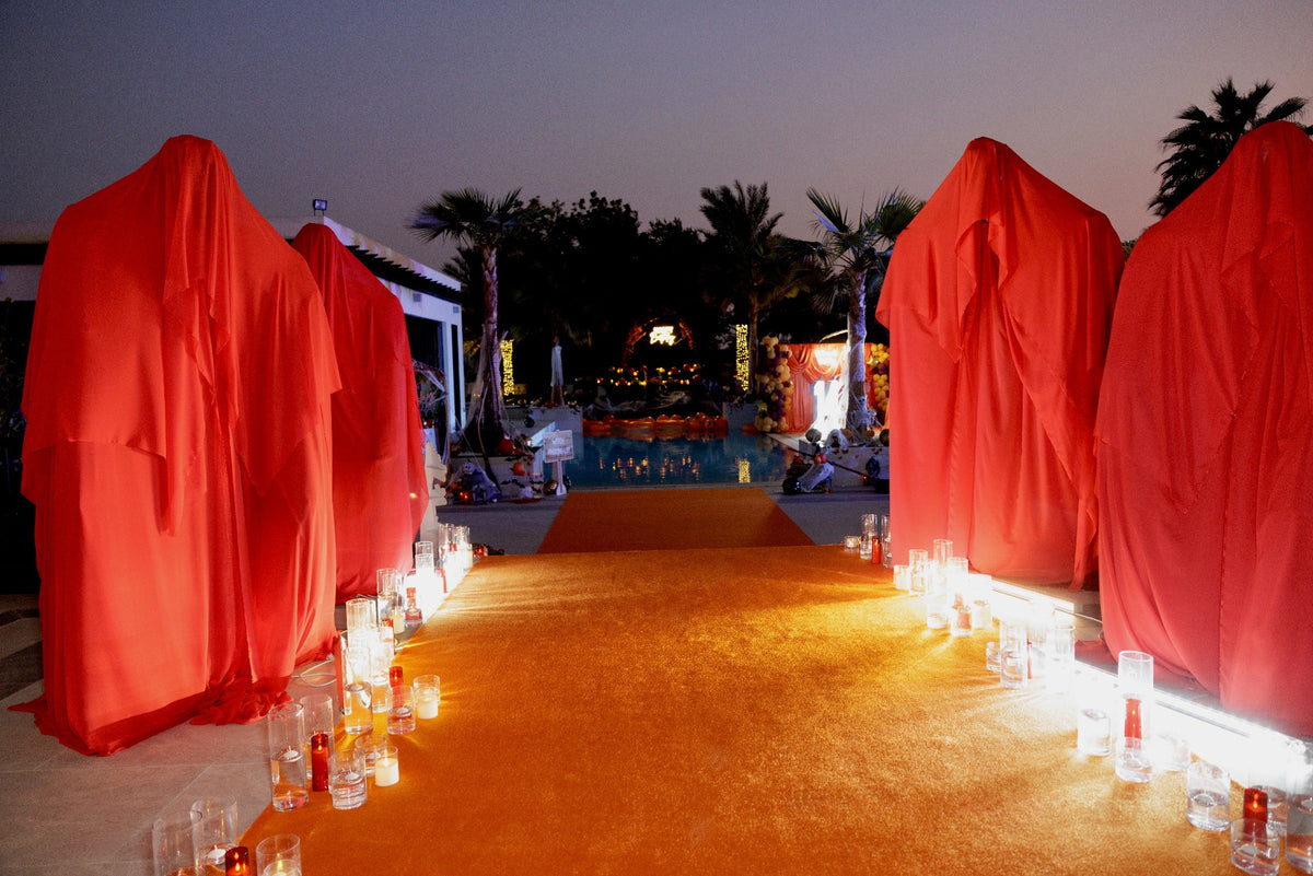 Crimson Ghosts Luxury Halloween Welcome Area with Red Draped Figures & Candlelit Walkway - rent