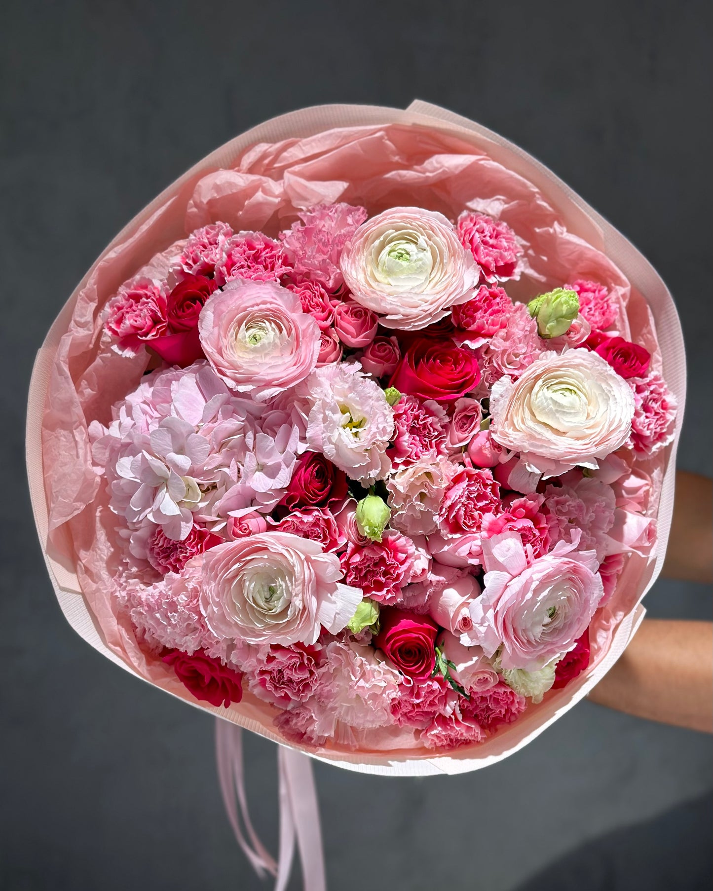 Fresh pink flowers with rananculus “Inferno”