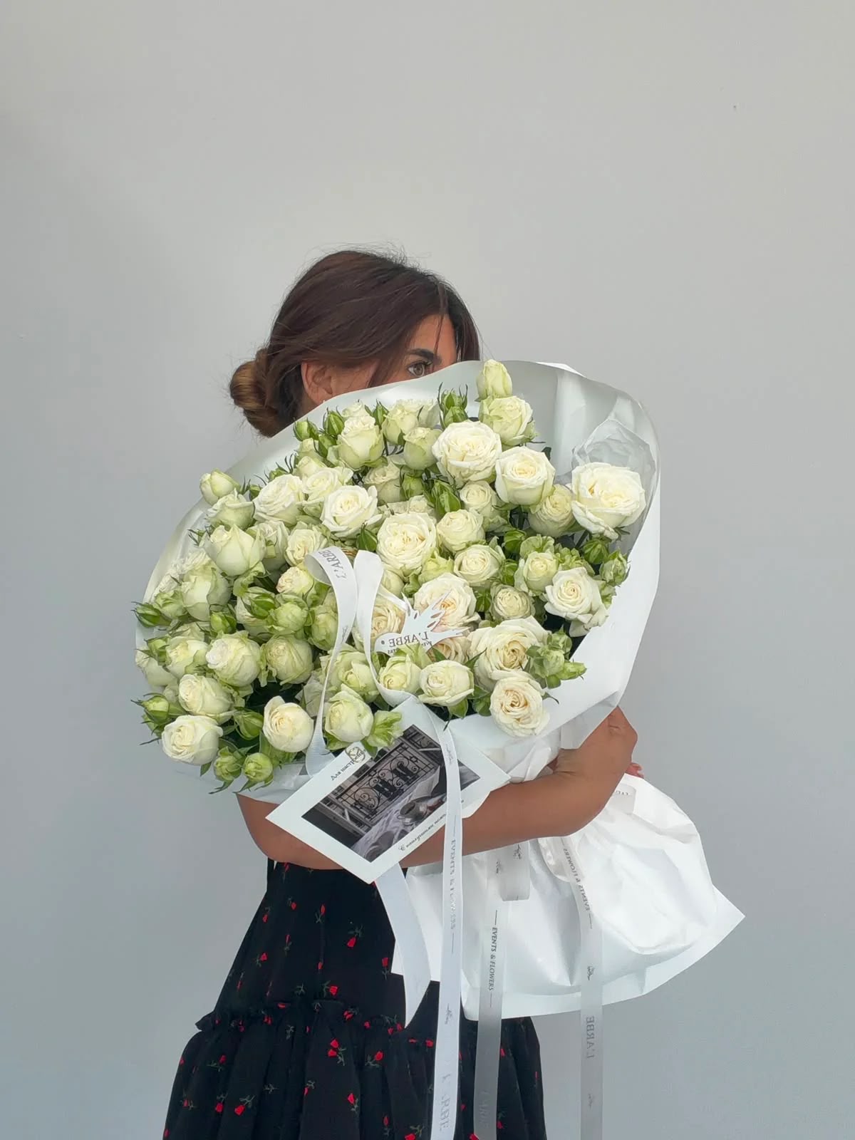 FLOWERS BOUQUET WITH WHITE ROSES IN WHITE WRAPPING
