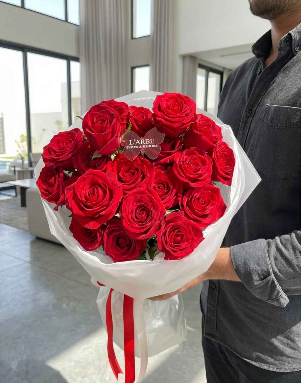 RED FLOWERS BOUQUET WITH ROSES IN WHITE WRAPPING 19 PCS