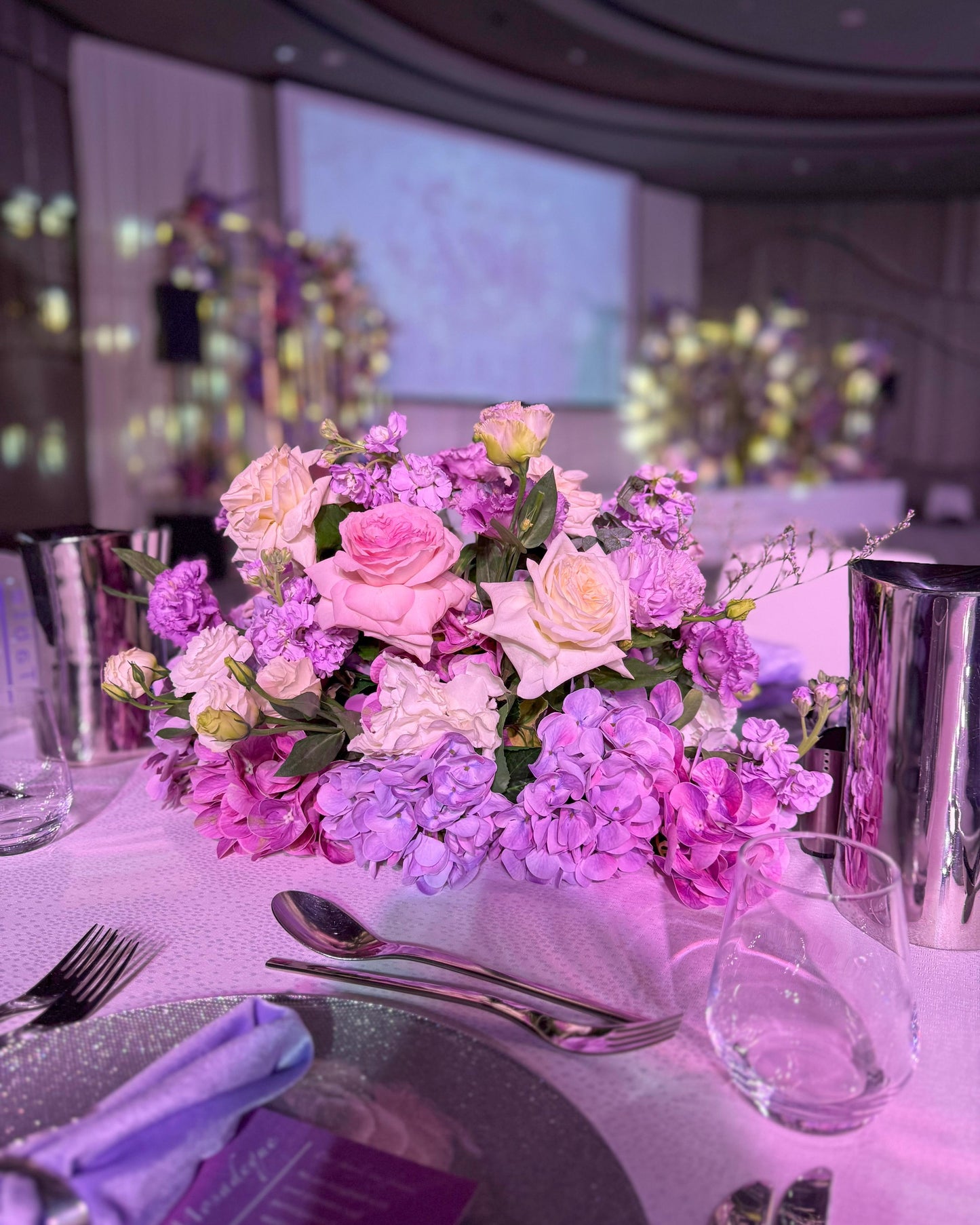 Centerpieces lilac color fresh and artificial flowers