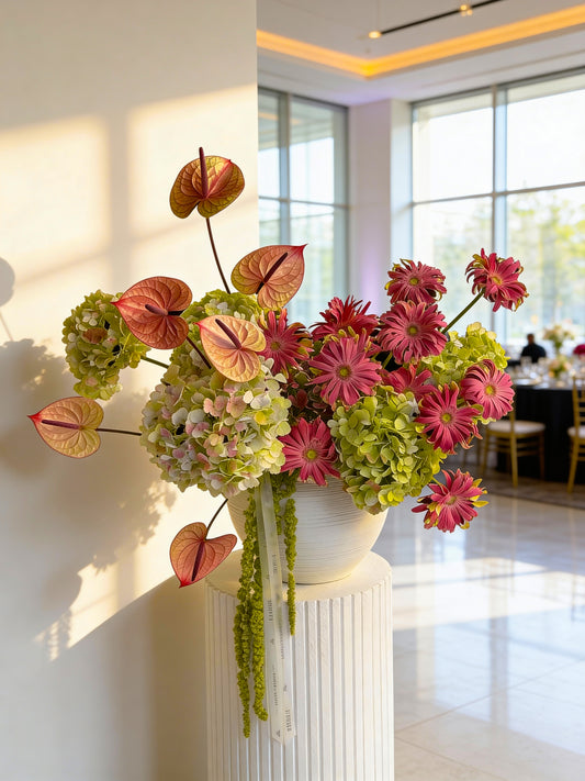 RED AND PINK INTERIOR FLOWERS IN VASE WITH HYDRANGEAS