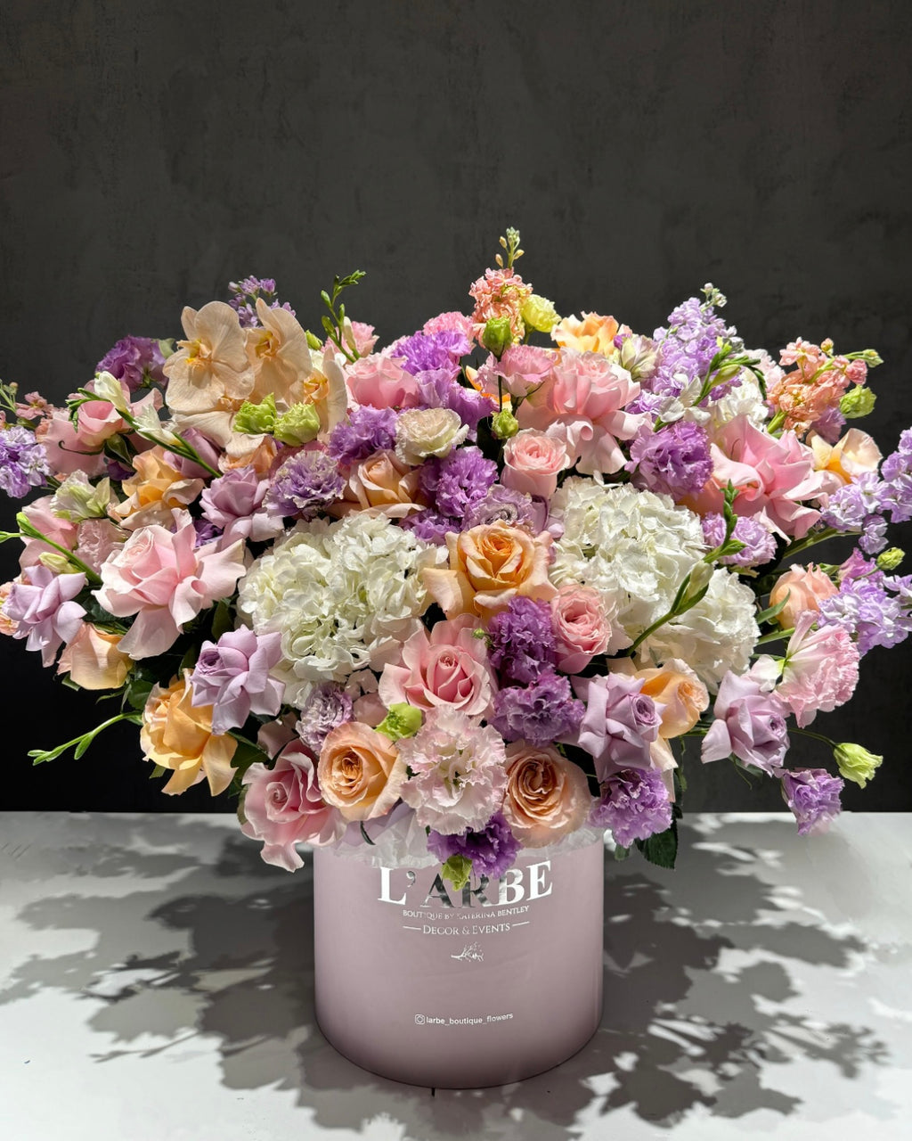 LILAC SHADES FLOWERS BOUQUET IN BOX WITH HYDRANGEA, MATTHIOLA AND FREESIA