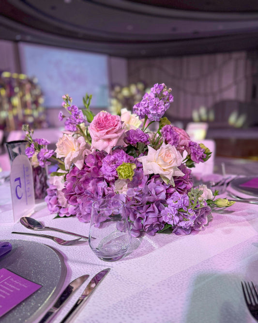 Centerpieces lilac color fresh and artificial flowers