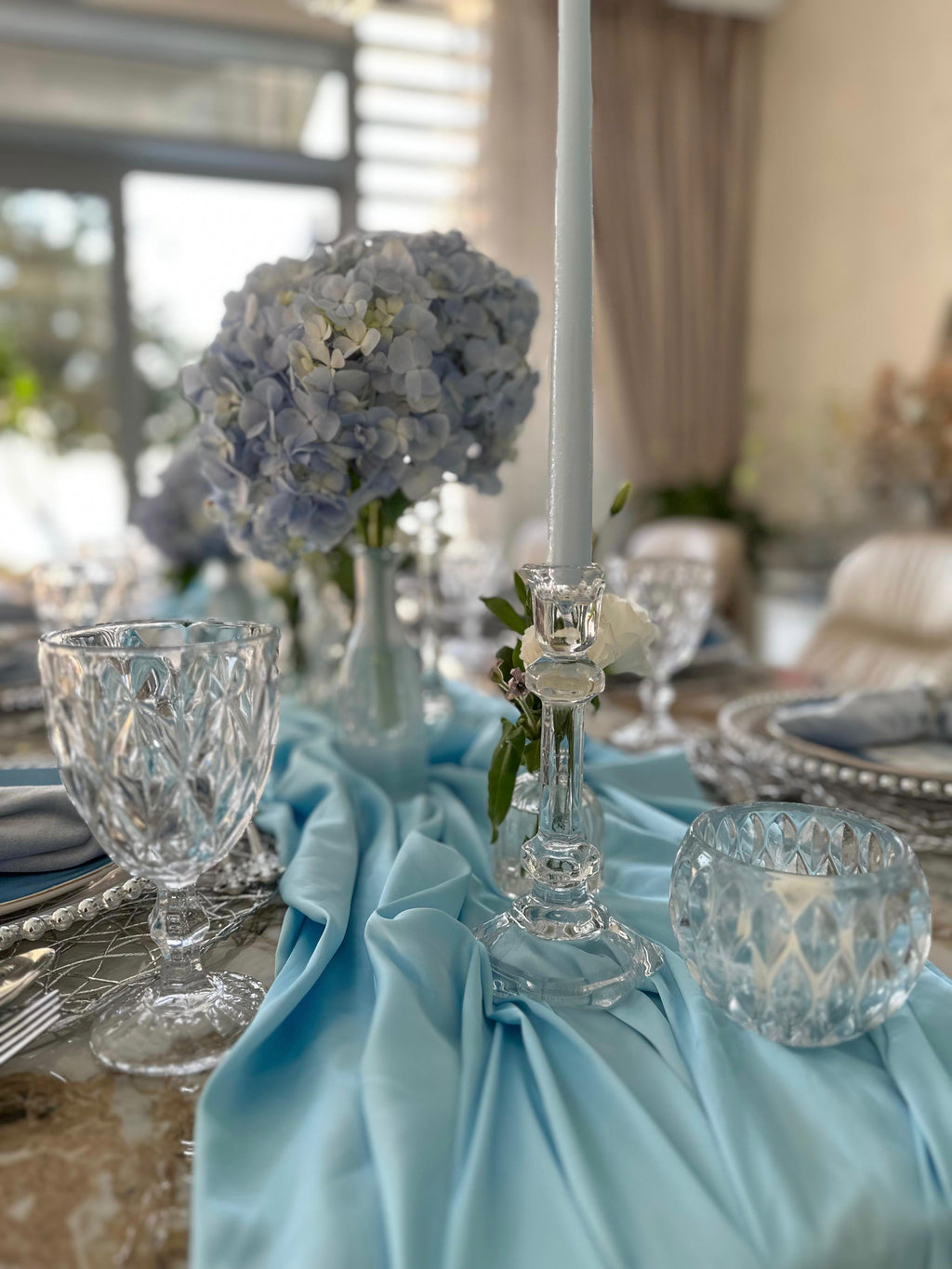 Table setup for 8 adults with flowers, candles - white, silver, blue (rent)