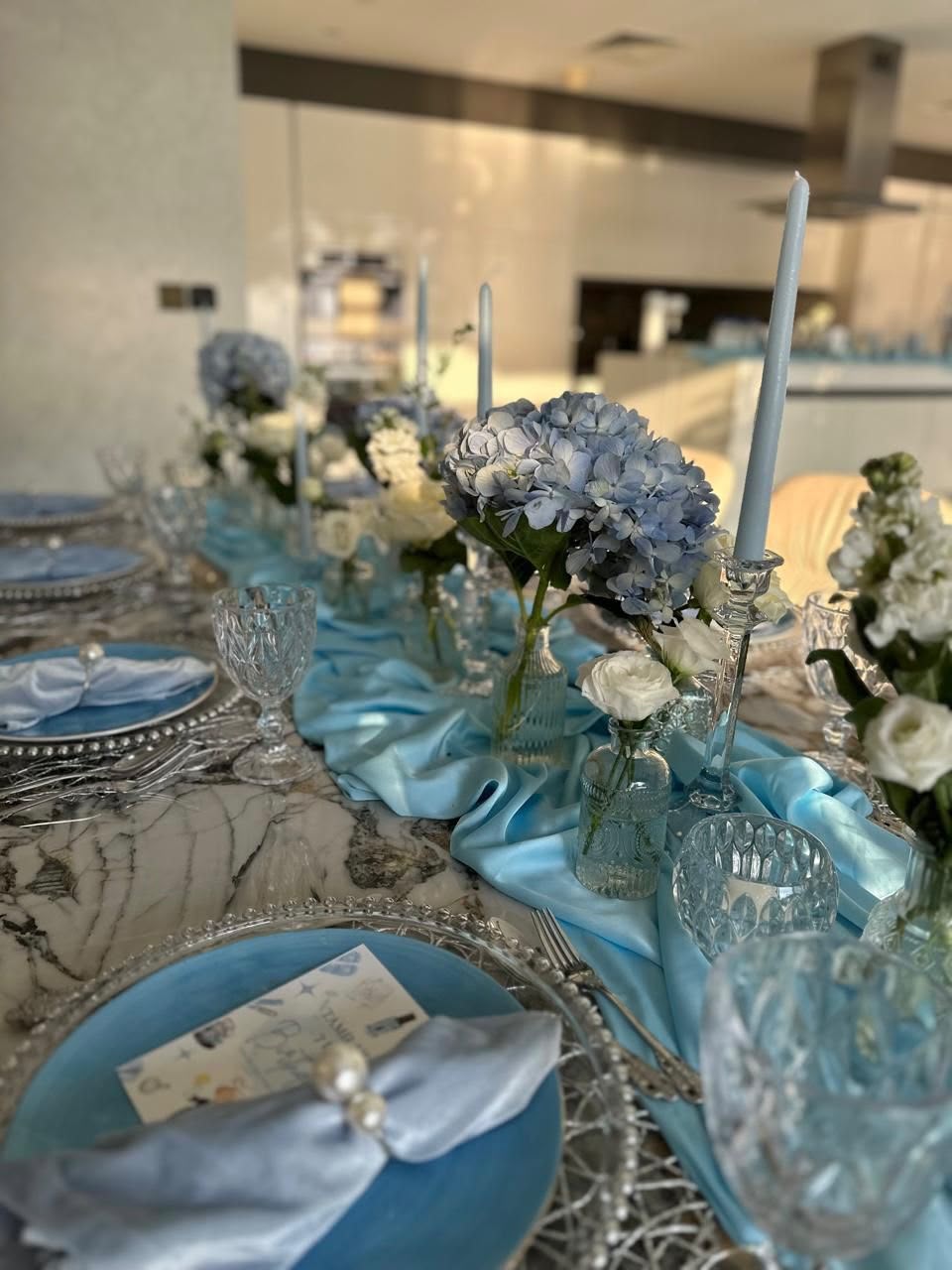 Table setup for 8 adults with flowers, candles - white, silver, blue (rent)