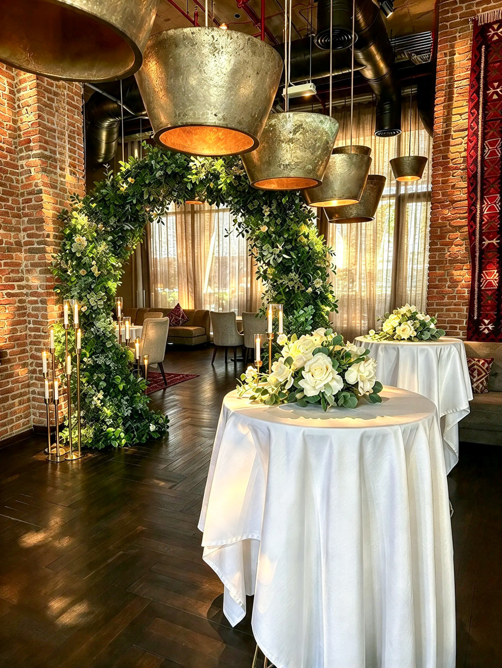 Elegant Green Floral Arch with Lush Greenery & Gold Candle Stands – Rent