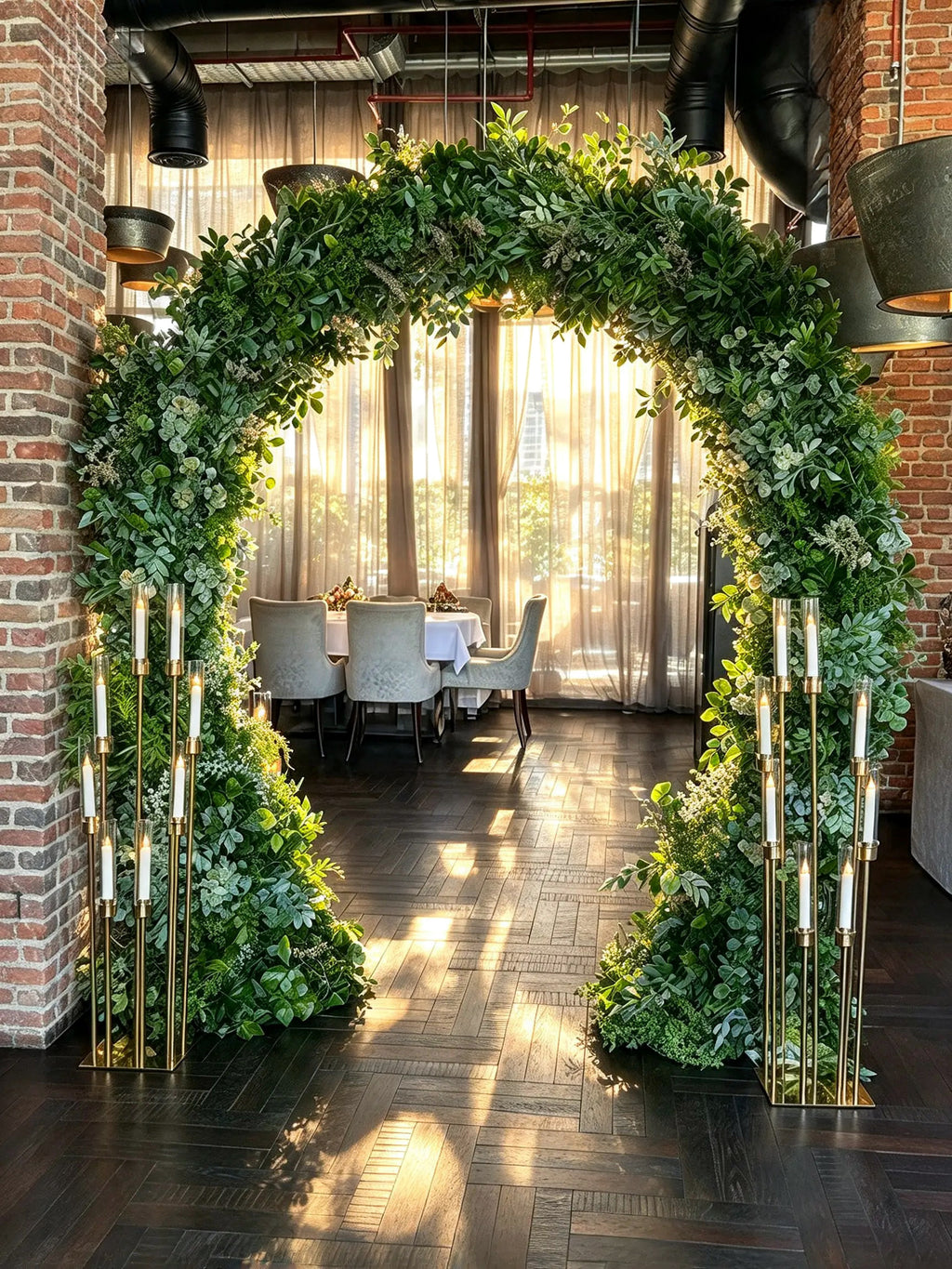 Elegant Green Floral Arch with Lush Greenery & Gold Candle Stands – Rent