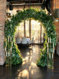 Elegant Green Floral Arch with Lush Greenery & Gold Candle Stands – Rent