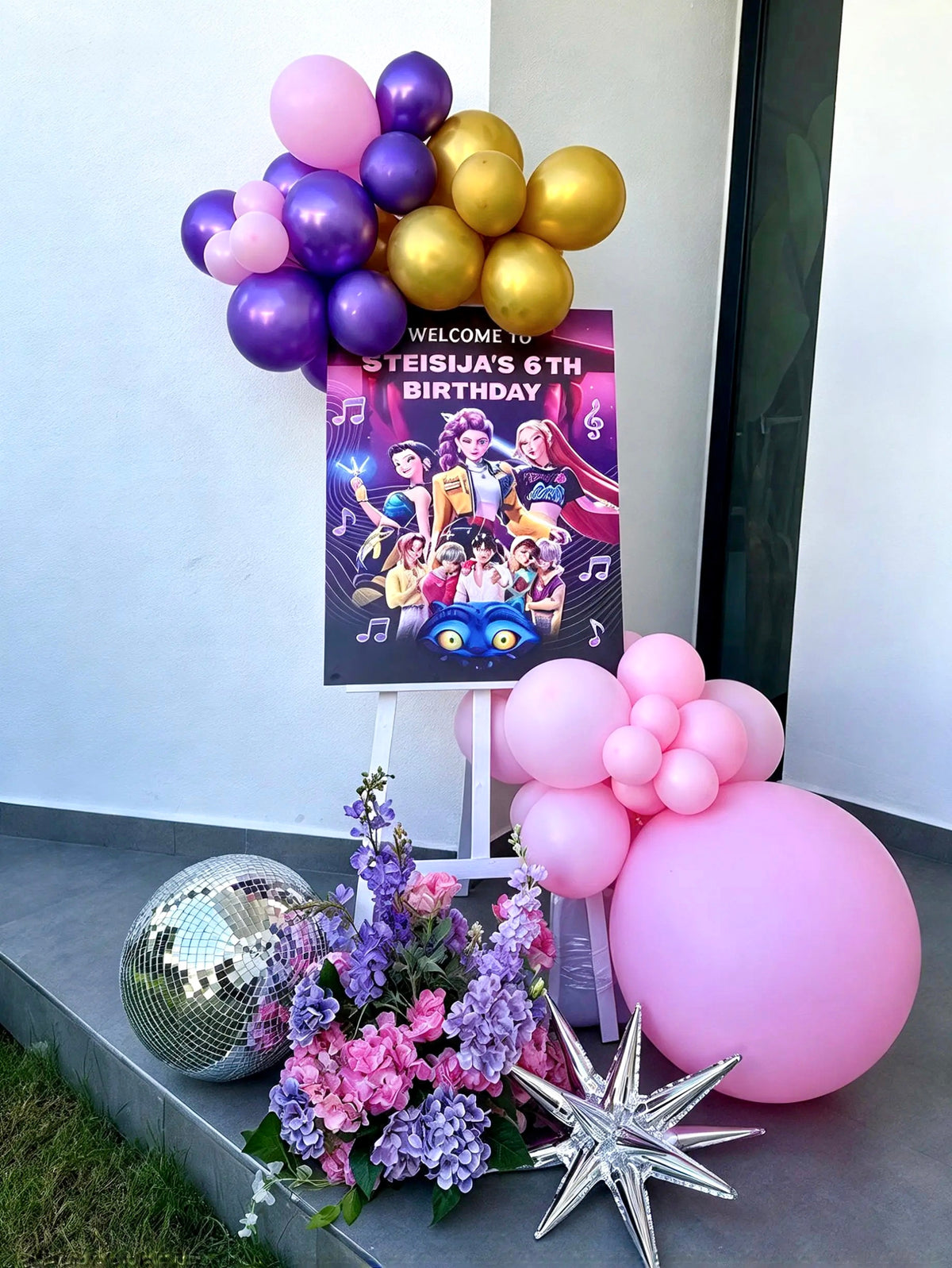 KPop Demon Hunters Themed Birthday Welcome Stand with Pink, Purple & Gold Balloon Garlands, Floral Decor & Disco Accents – Rent