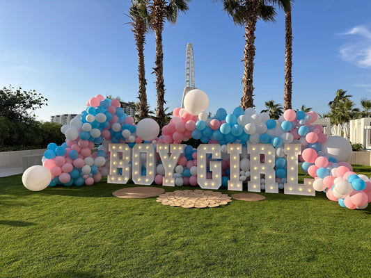 Gender reveal Boy or Girl with many balloons