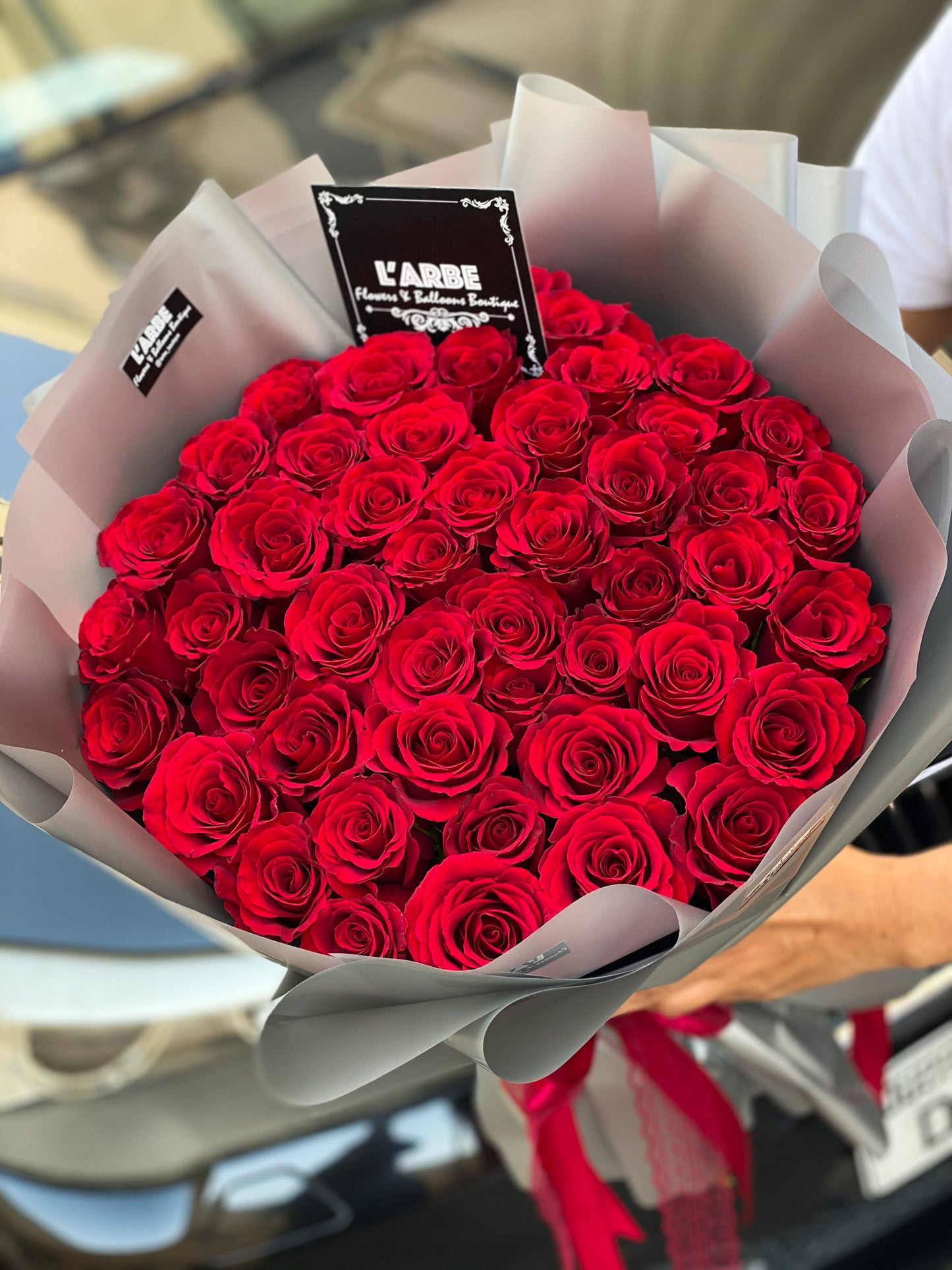 53 Red roses in silver wrap