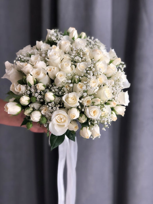 White roses and spray roses with gypsophila