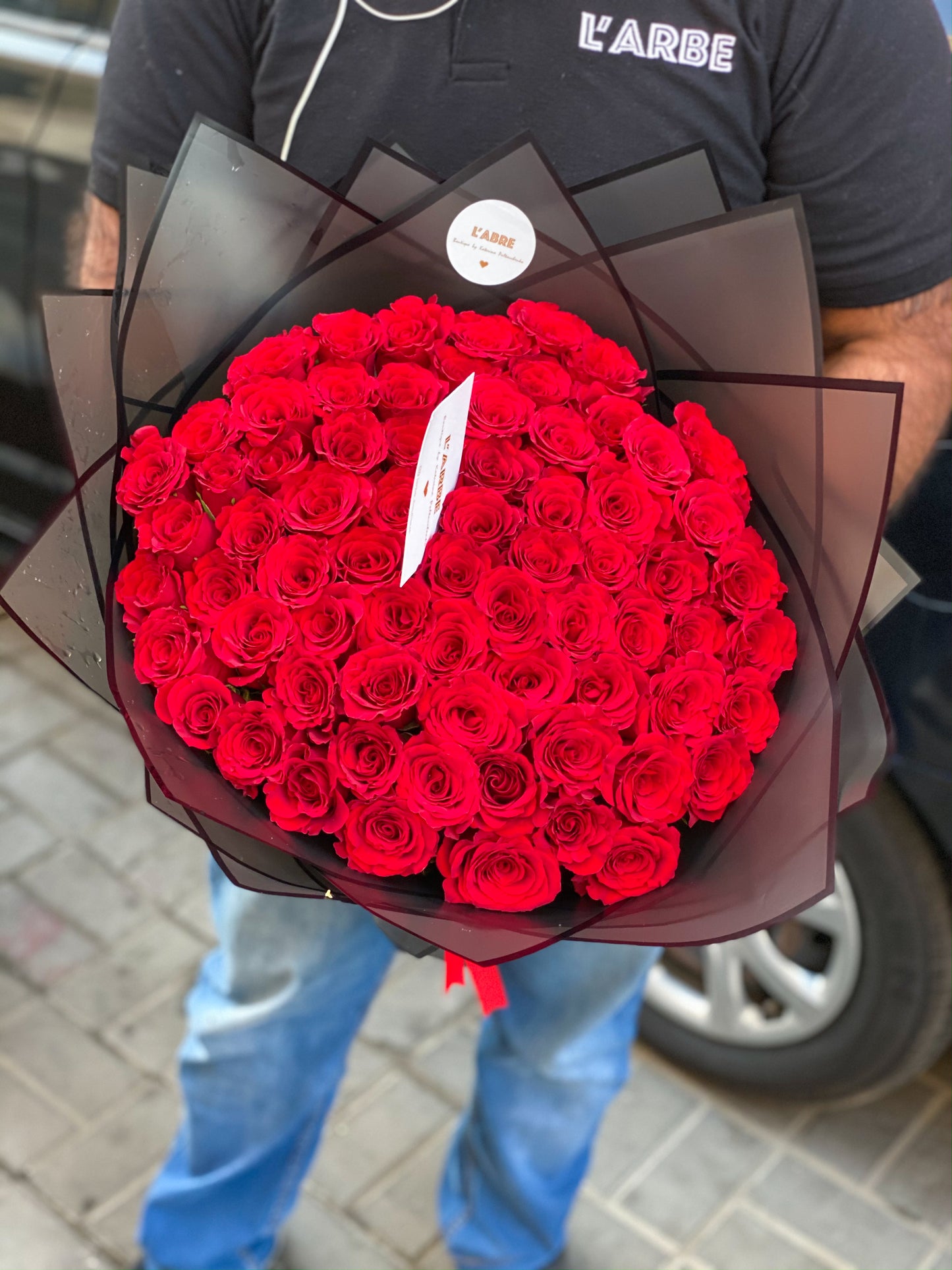 Red roses in black wrapping 🖤