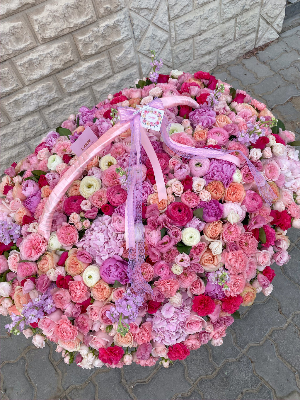 BASKET WITH PEONIES, RANUNCULUS, GARDEN ROSES