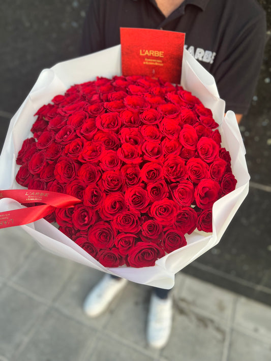 Red roses with white wrapping